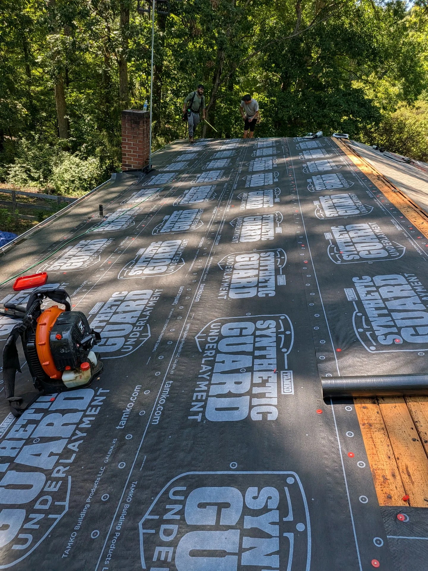 Roof underlayment installation on an owner-supplied Happy Days project